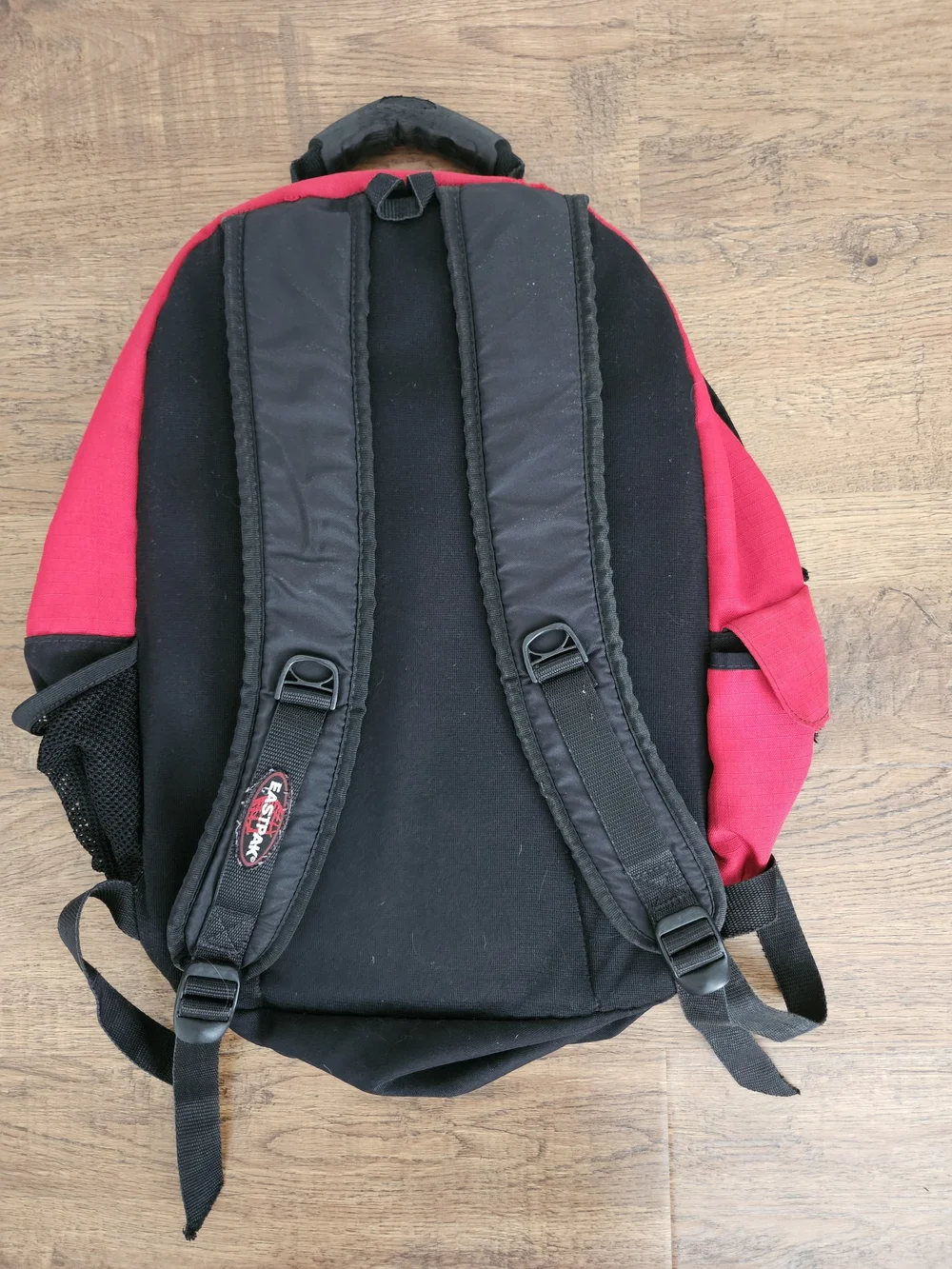 Eastpak Red and Black Backpack with Multiple Compartments